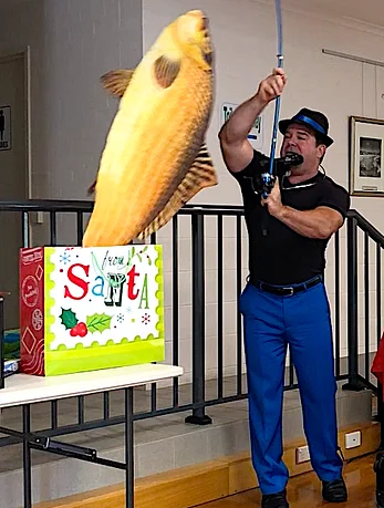 3C1ED5CF0918F774.png Glenn Keeley fishing for laughs with his kids magic shows