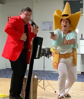Glenn Keeley and an audience member performing. Magician for Wollongong and beyond